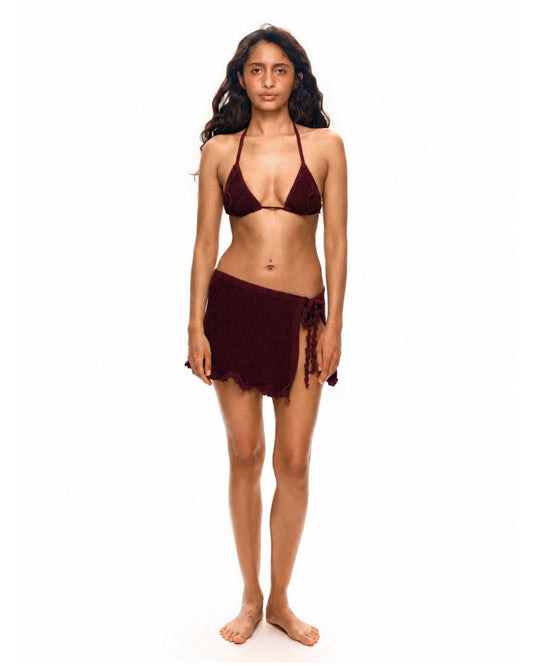 Beach wrap skirt in burgundy with tassel-like trim and scalloped ruffled hem