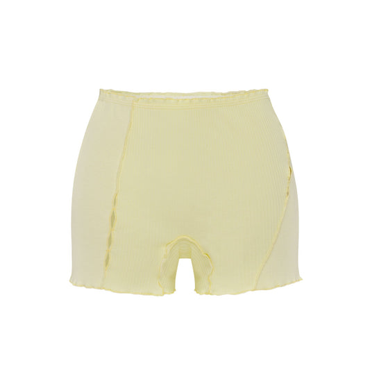 Light yellow shorts with elastic waistband and curved raw edges