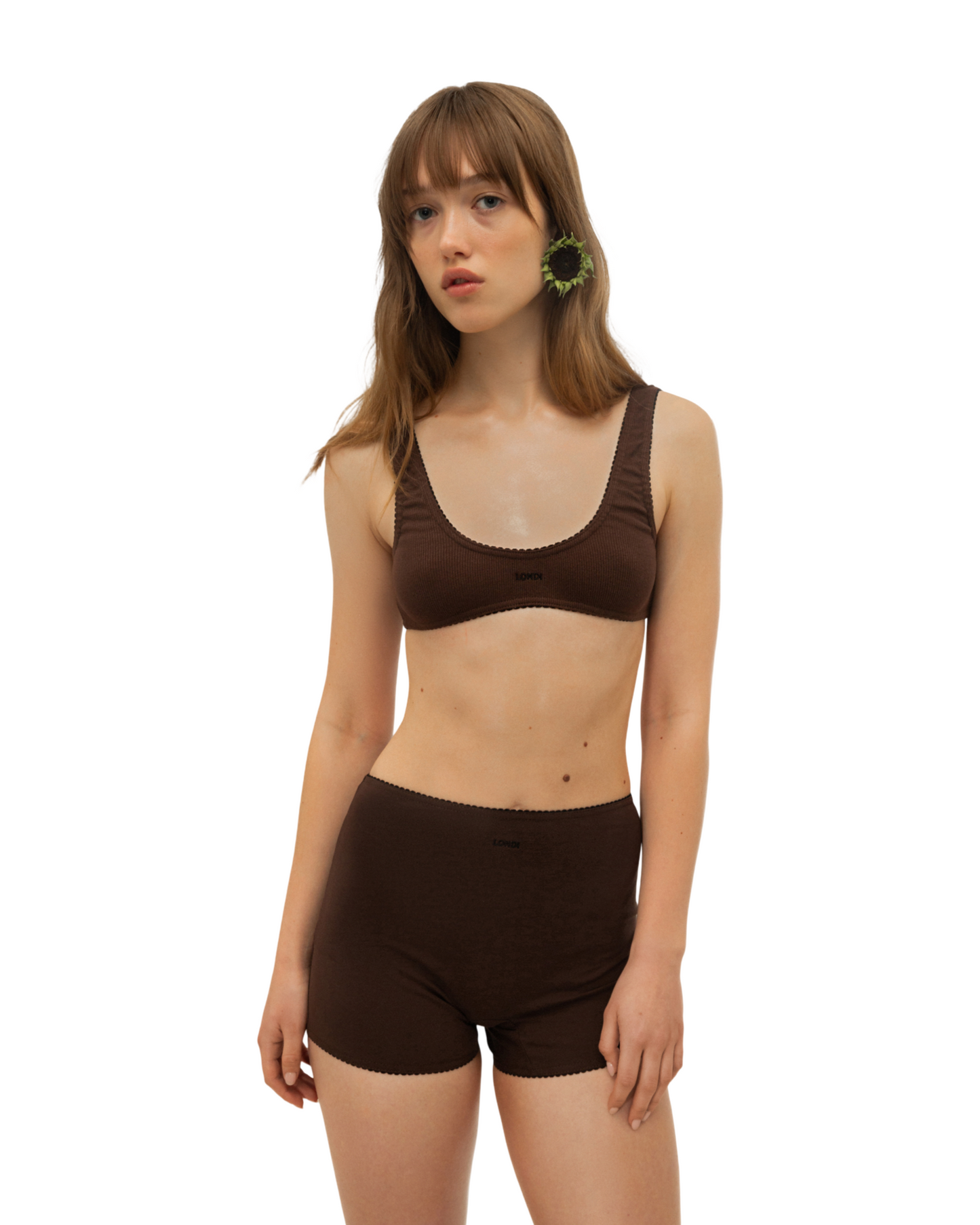 Brown scoop-neck bralette top with wide straps on a model