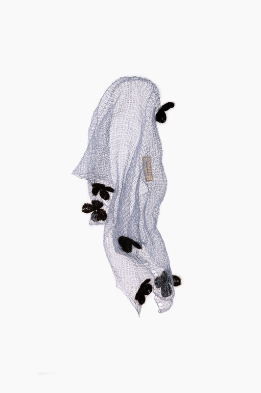 Blue sheer scarf with black clover appliques and a triangular drape