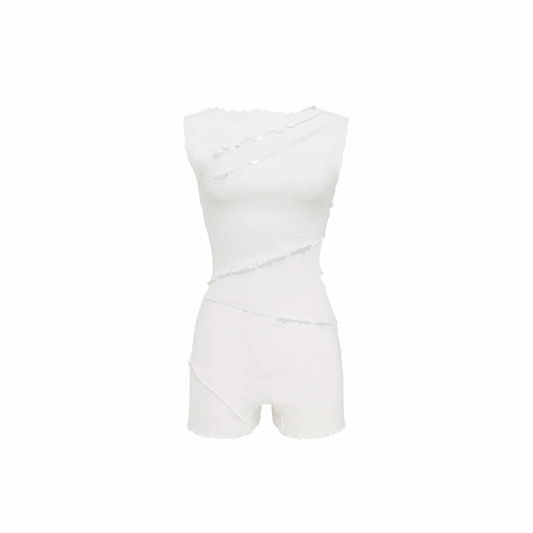 White wavy jumpsuit with sleeveless bodice, fitted waist, and short legs.