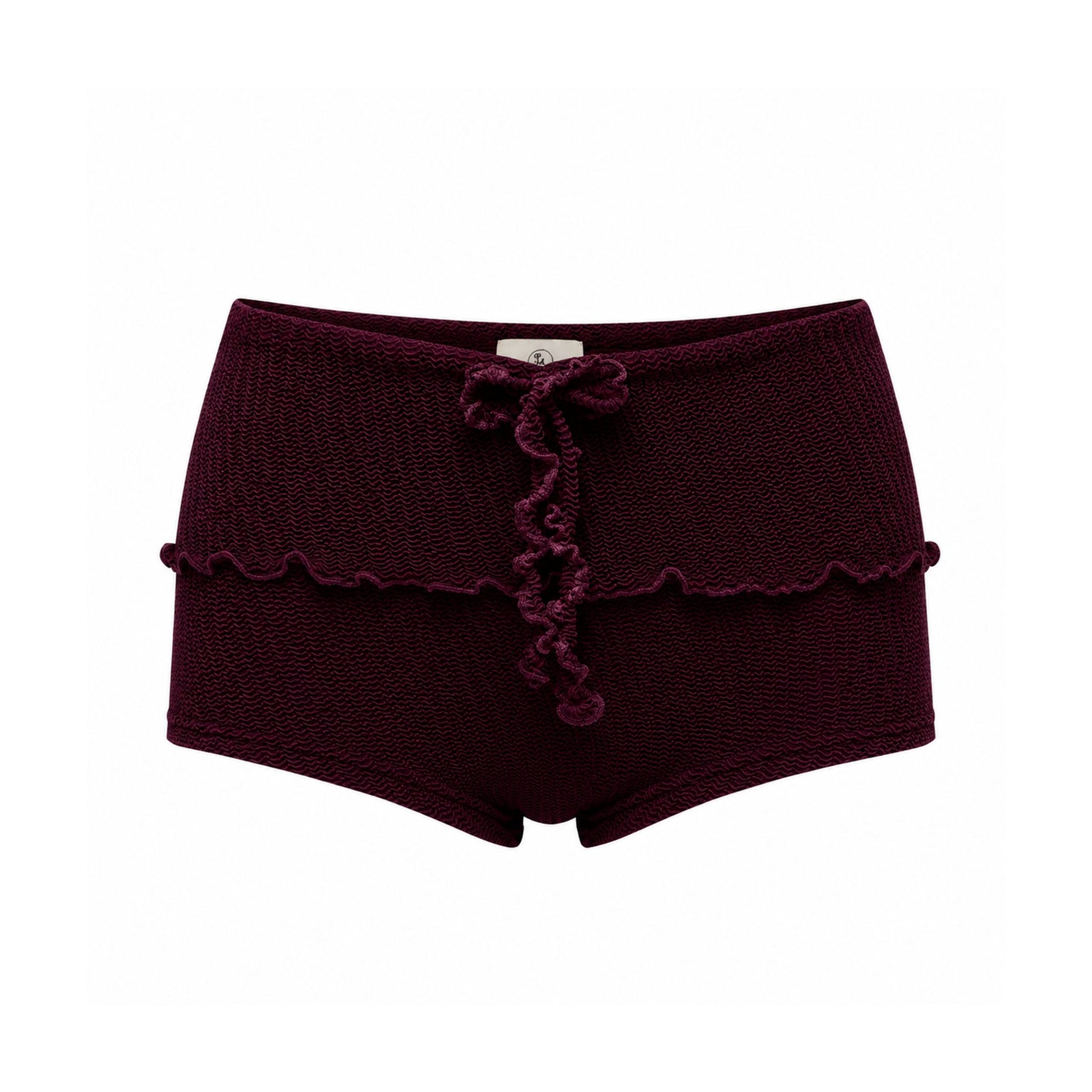 Bow-tie swim shorts in dark maroon with scalloped trim and short legs