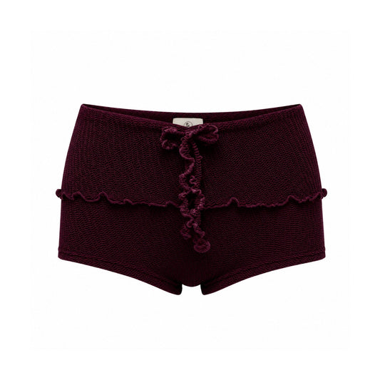 Bow-tie swim shorts in dark maroon with scalloped trim and short legs