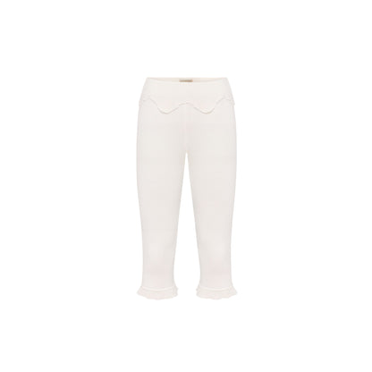 White wavy capri pants with scalloped waist detail and cropped flared cuffs.