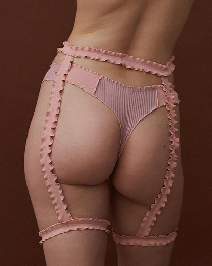 Pink thong with ribbed fabric and scalloped trim, high-cut back view
