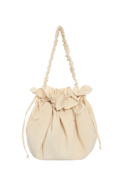 Beige drawstring bag with bow ruffle and long tie handles