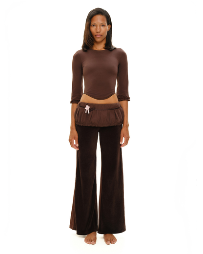 Brown long-sleeve top with gathered cuffs; ruched hem and small tassel detail
