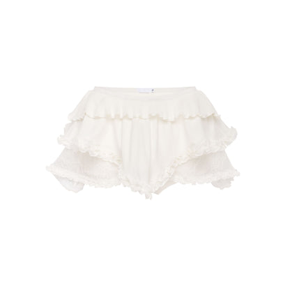 White lace skort with layered ruffle trim and scalloped edges