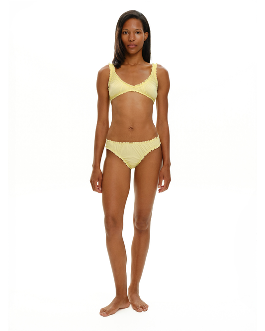 Yellow ruched bralette with scalloped ruffle trim and thin adjustable straps