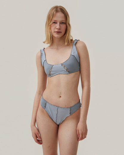 Blue ribbed thong with scalloped trim and lace-up style front seam