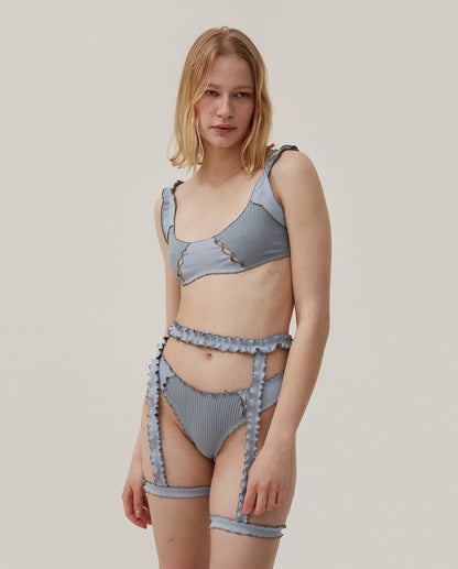 Light blue ribbed bralette with thin straps, scalloped edges, tie trim