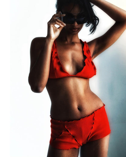 Red ribbed boyshorts on model, high-rise waistband, moderate coverage
