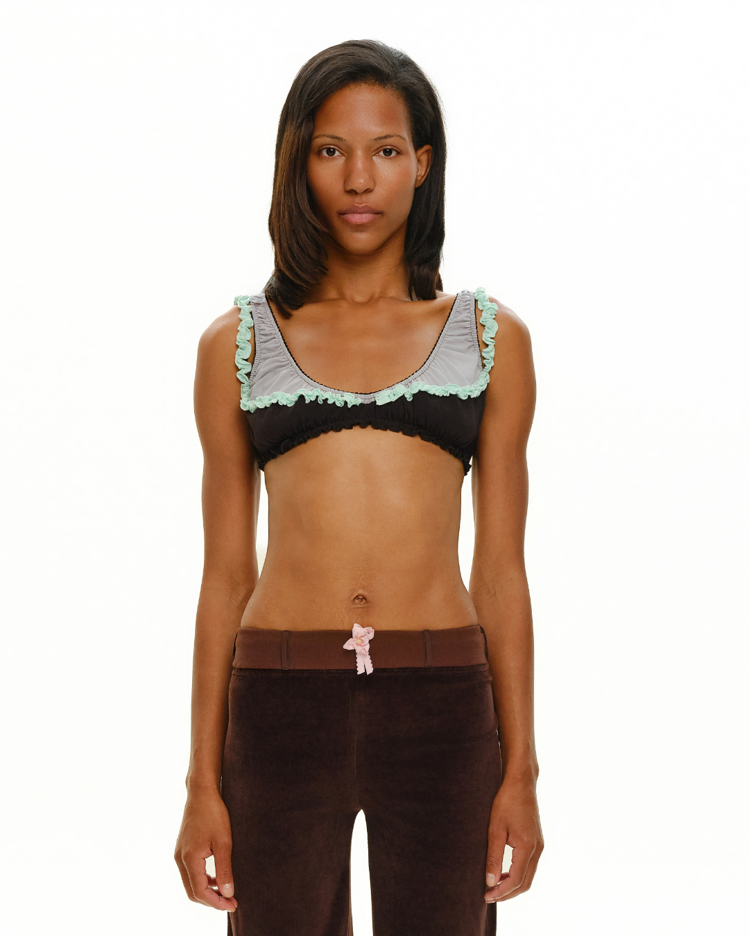 Black double bra with mint ruffled trim and scalloped neckline