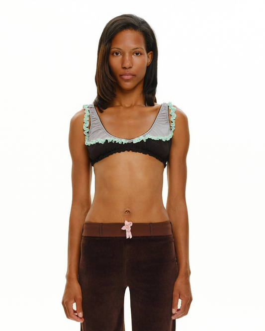 Black double bra with mint ruffled trim and scalloped neckline