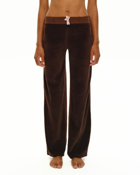 Brown velour wide-leg trousers with pink bow detail on waistband