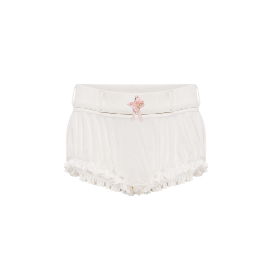 White shorts with elastic waistband and pink rosette detail