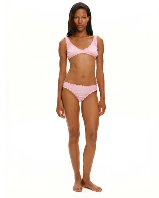 Pink ruched bralette top with ruffled underband and straps