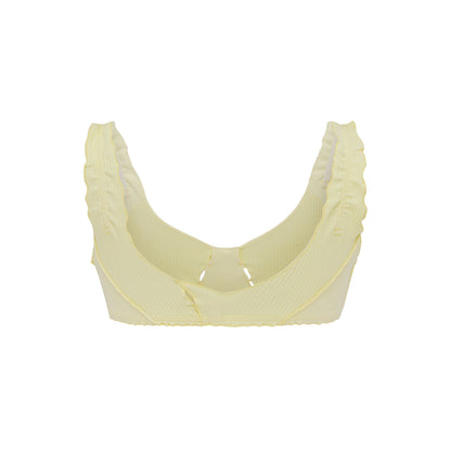 Pale yellow bralette with ruffled arm openings and soft curved cups