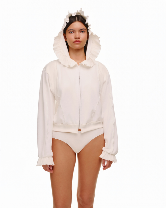 White hoodie with ruffled hood and front zipper, long puff sleeves