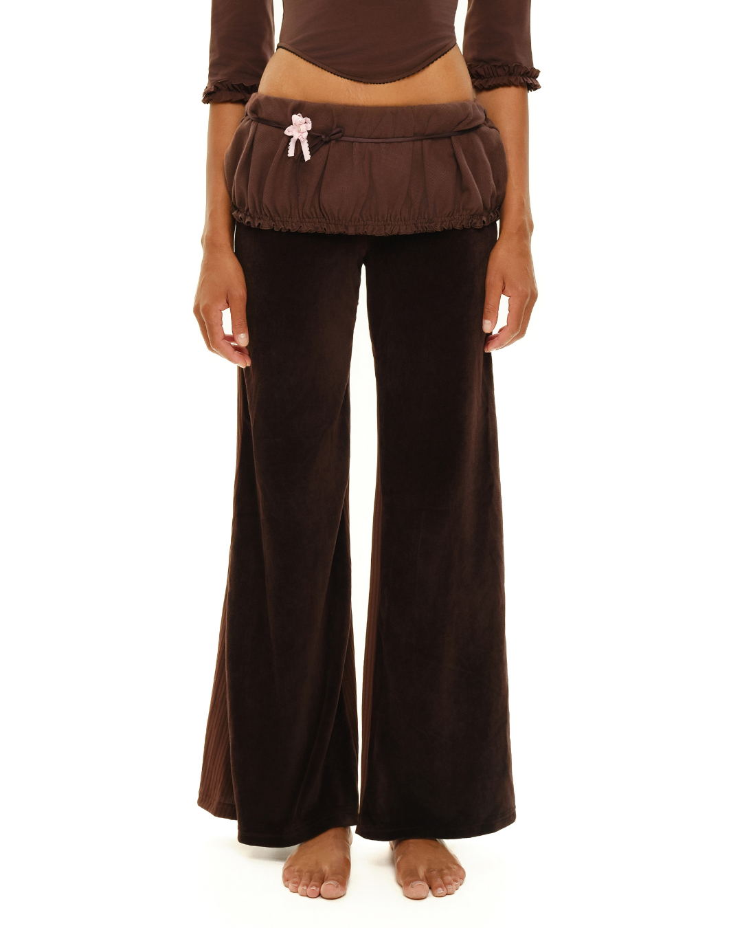 Brown wide-leg pants with ruffled elastic waistband and white drawstring bow