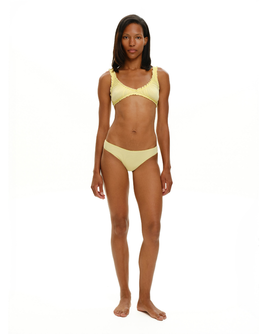 Yellow seamless tanga underwear worn by model
