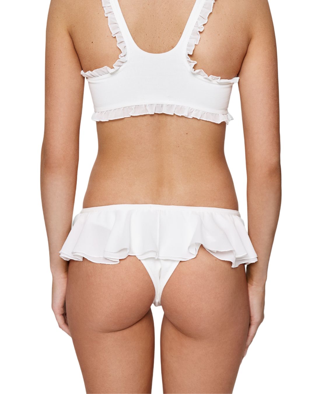 White frill tanga panties with ruffled waist band, back view on model.
