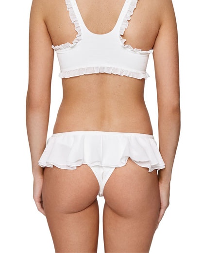 White frill tanga panties with ruffled waist band, back view on model.