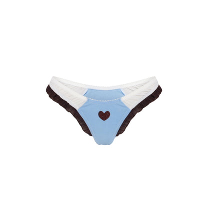 Light blue tanga with heart patch, dark ruffle edges, and white trim