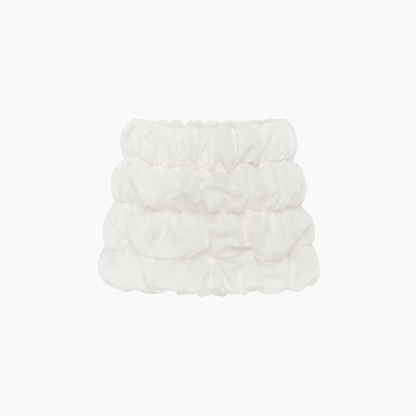 White tiered ruffle mini skirt with elastic waistband and gathered layers