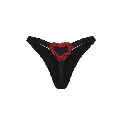 Black thong with red heart applique at center front
