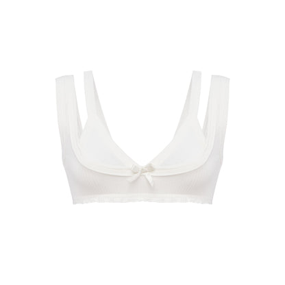 White bralette top with scalloped scoop neckline, thin straps, and center bow detail