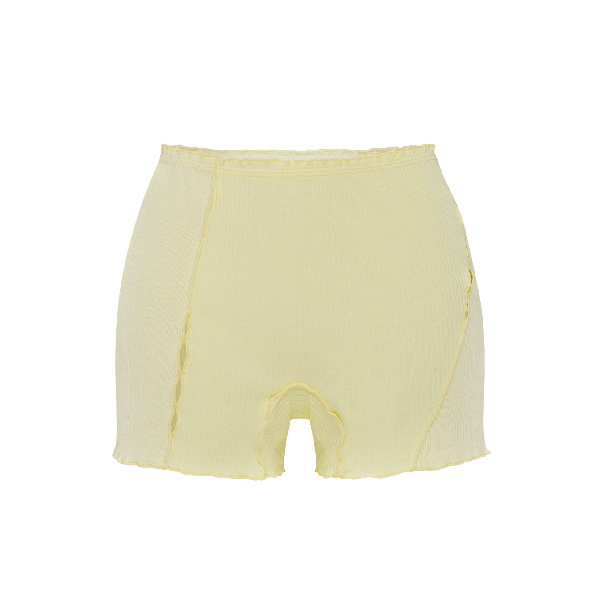Light yellow shorts with elastic waistband and curved raw edges