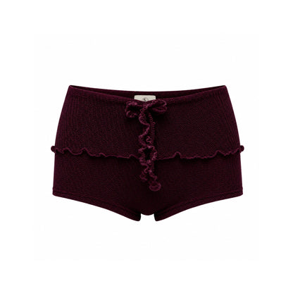 Brown swim shorts with scalloped ruffle hem and front bow tie at waistband