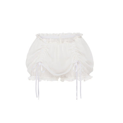 White drawstring shorts with ruffled edges and tie bows at sides.