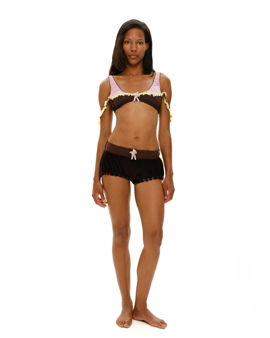 Ruffled lingerie bra with dark brown cups, pink bows, and pale yellow ruffle trim