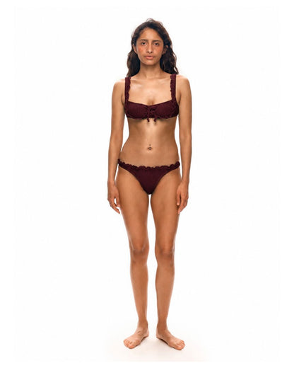 Bikini top with ruffle trim and thin straps, dark brown, center knot.