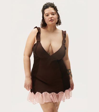 Brown mini dress with deep V neckline and pink tulle ruffle hem, bow shoulder ties