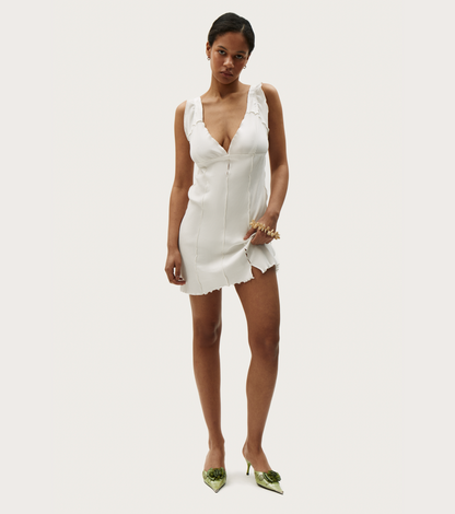 White wavy sleeveless mini dress with fitted seams and ruffle-trim straps