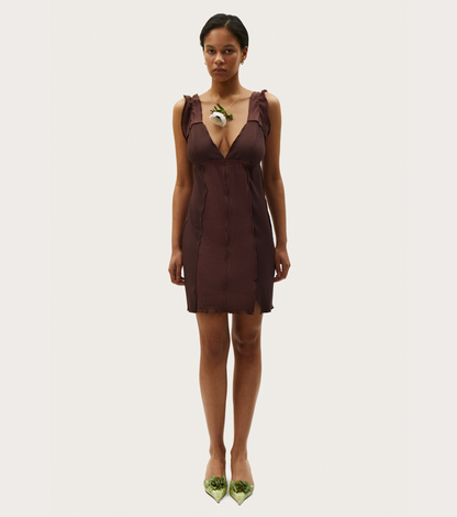 Dark brown sleeveless mini dress, deep V-neck, ruffled shoulder details, scalloped hem