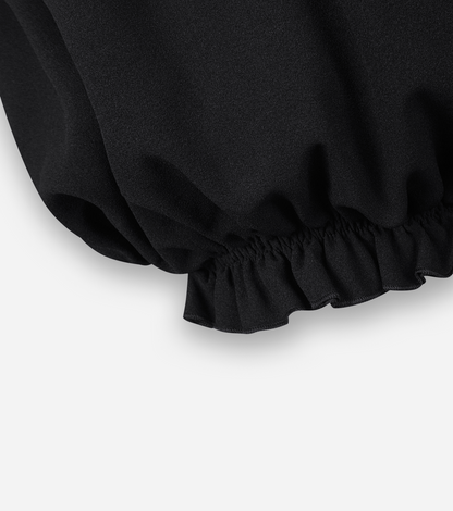 Black ruffle hem micro shorts with gathered elastic cuff