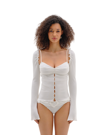 White fitted knit top with draped corset front, spaghetti straps, long flared sleeves