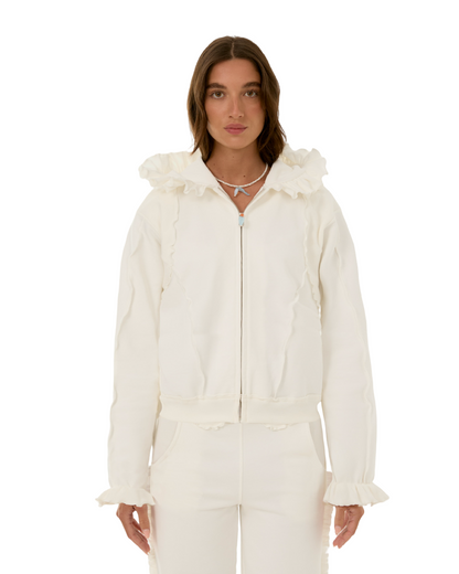 White zip-up hoodie with ruffled hood and long sleeves with ruffled cuffs