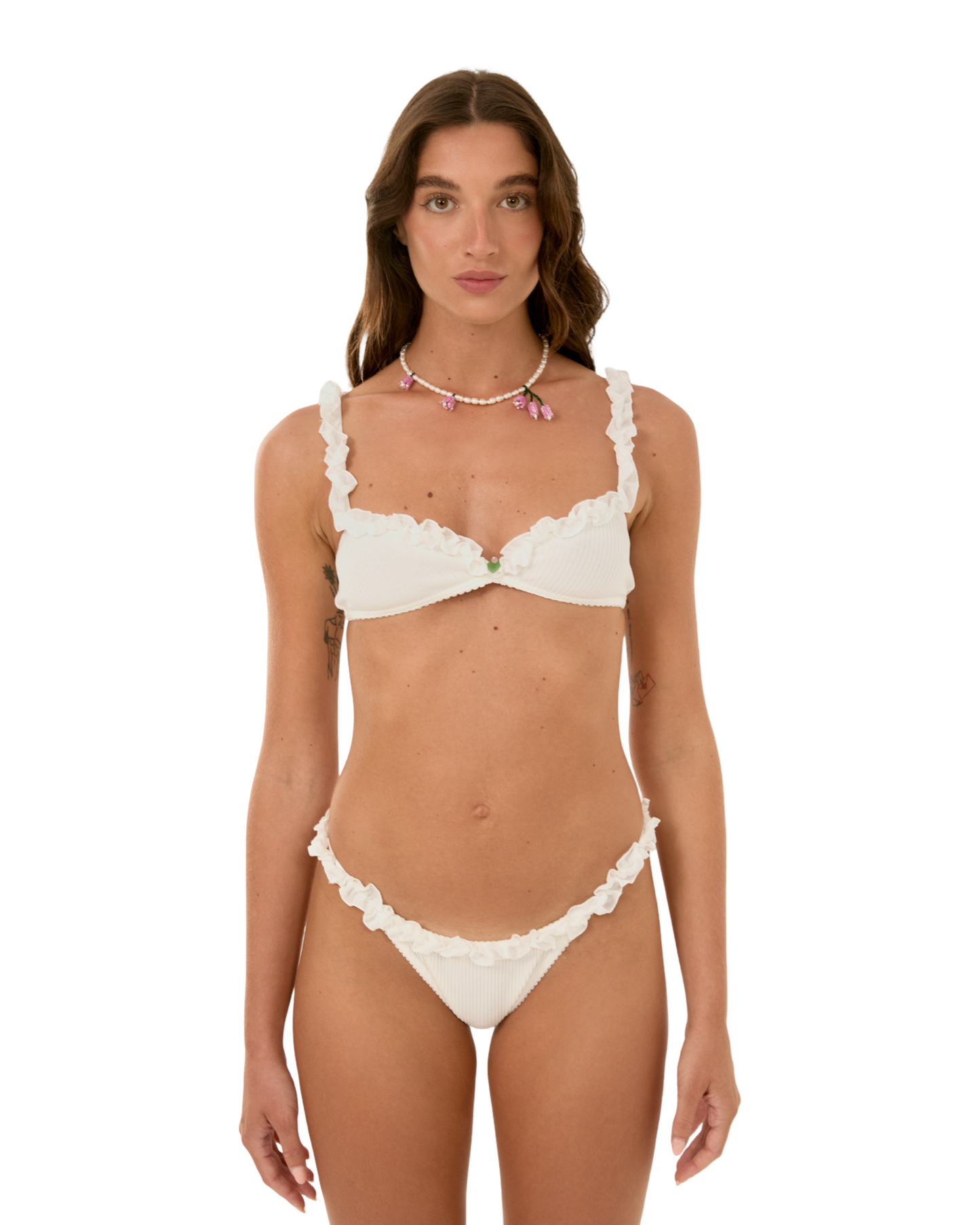 White ruffled bralette and matching bikini briefs set on model