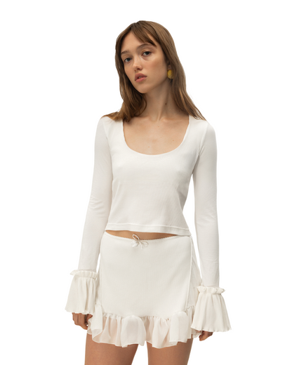White long-sleeve ruffle top with drawstring waist tie, scoop neck, and tiered skirt