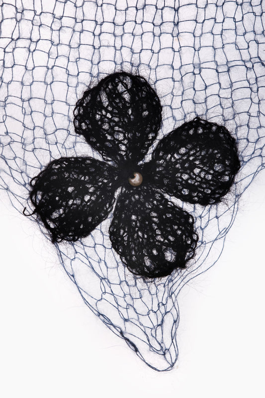Black clover flower detail on blue net scarf with scalloped mesh edge