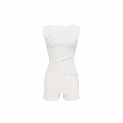 White wavy jumpsuit with sleeveless bodice, fitted waist, and short legs.
