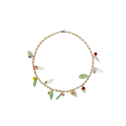 Beaded necklace with leaf and heart charms, red and green accents