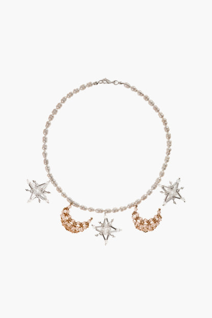 Constellation necklace with pale pearl beads, gold-tone crescent accents, star charms