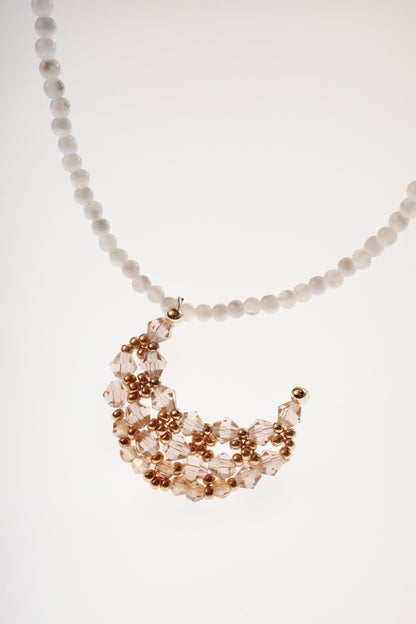 Moon necklace with white bead chain and rose-gold crystal crescent charm