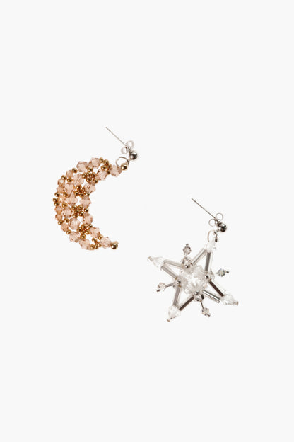 Constellation earrings: one peach rhinestone hoop and one white crystal star drop